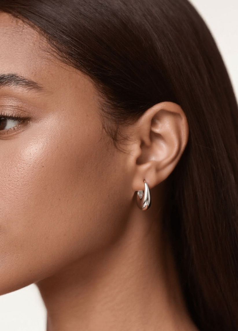Close-up of a woman wearing RIEN Aeris Earrings Hoop earrings