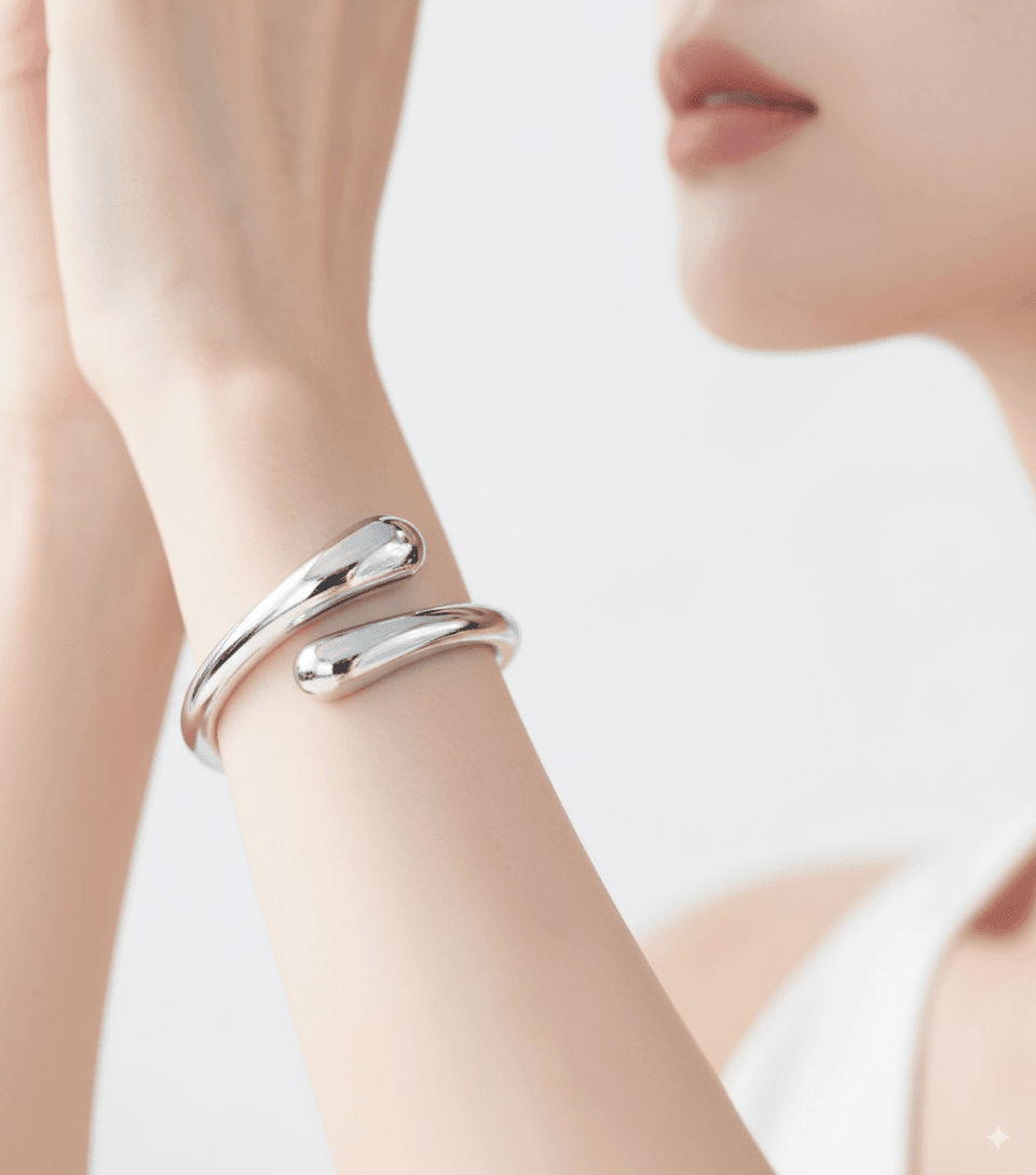 Woman wearing RIEN Bliss Bangle Open bangle on a white background