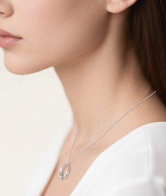 Woman wearing RIEN Opaline Necklace Pendant necklace